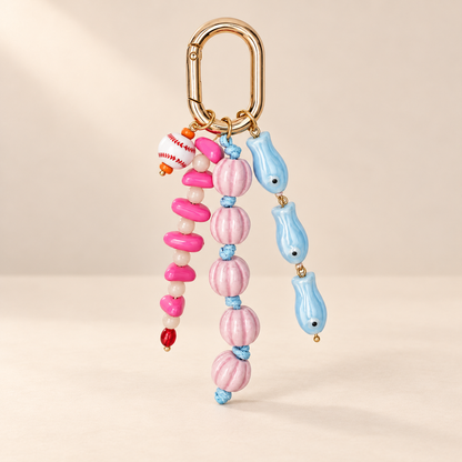 Beadora blue woven rope and beaded bag charm on warm ivory background