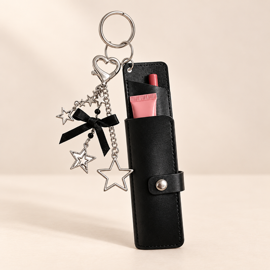 Bellarose Bow & Star Lipstick Bag Charm — Saint & Rose studio photograph on warm ivory background