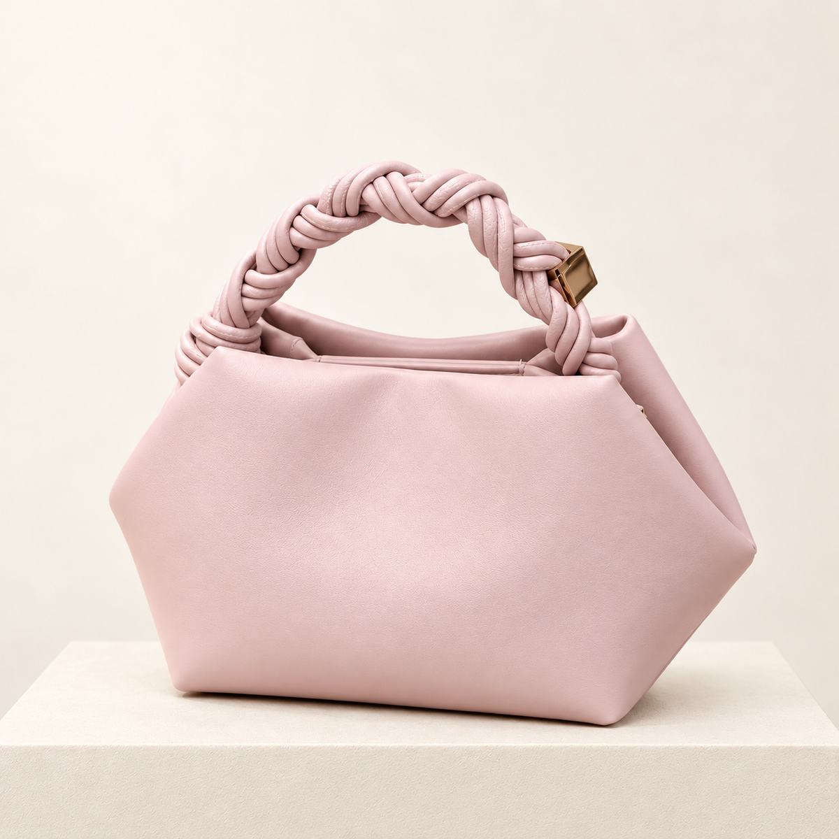 Elvoria Leather Dumpling Bag — ivory pedestal studio photograph