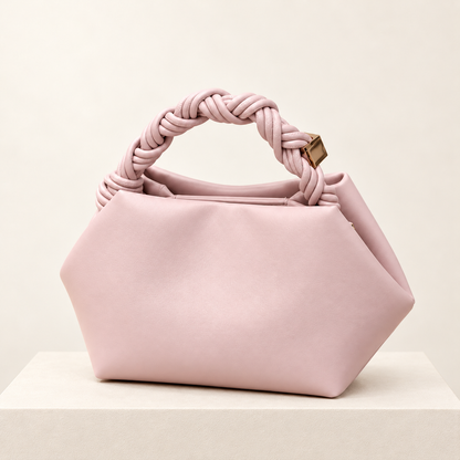 Elvoria Leather Dumpling Bag — ivory pedestal studio photograph