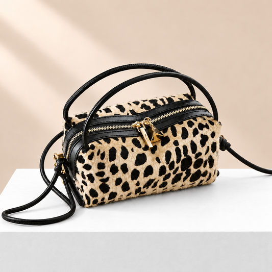 Leovelle Square Box Bag — white plinth, warm beige background