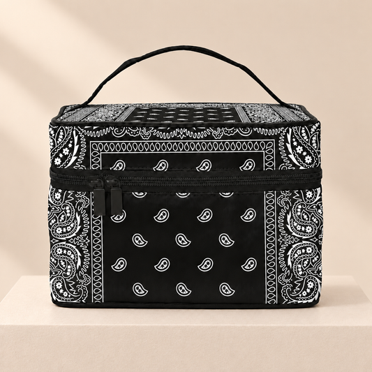 Paiselle Black Paisley Cosmetic Bag — warm beige studio background