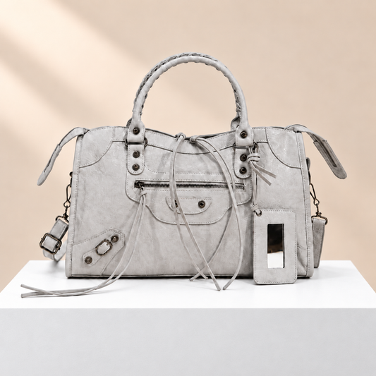 Vantessa City Motorcycle Tote Bag — white plinth, warm beige background