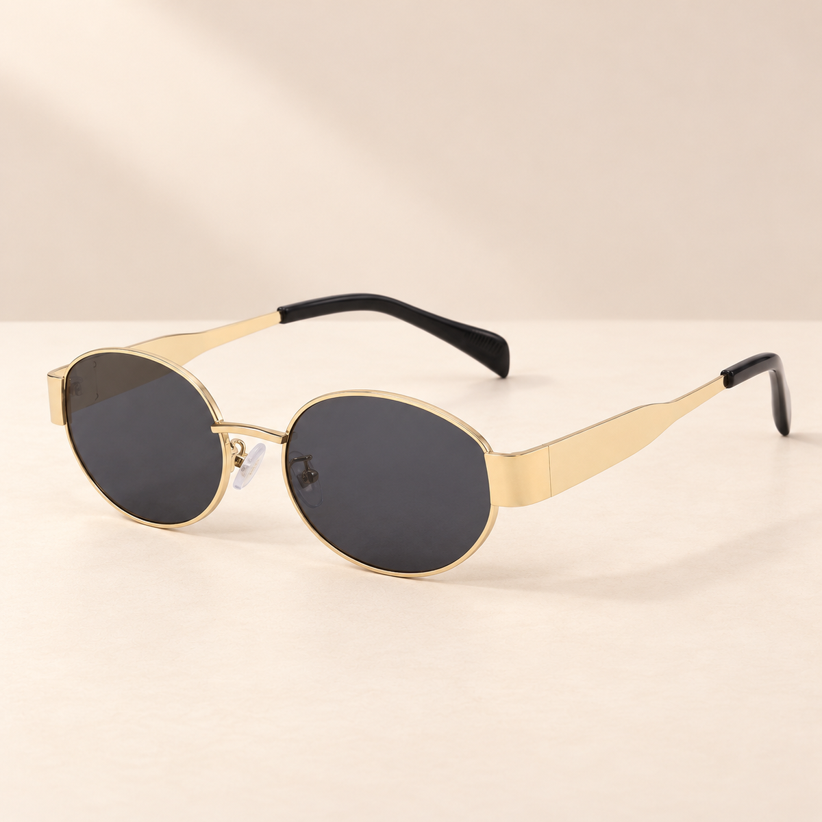 Virelle Retro Oval Sunglasses — Saint & Rose studio photograph on warm ivory background